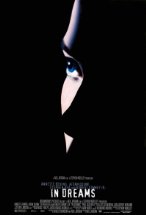 Silhouetted face of a woman with blue eyes