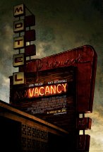 Grungy motel sign with the vacancy lights on